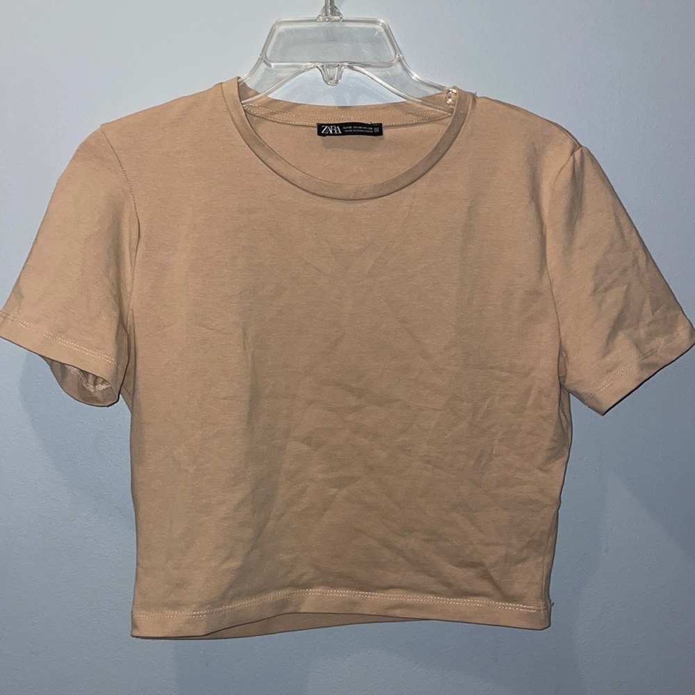 Zara medium nude top. Not cropped but not full length either.